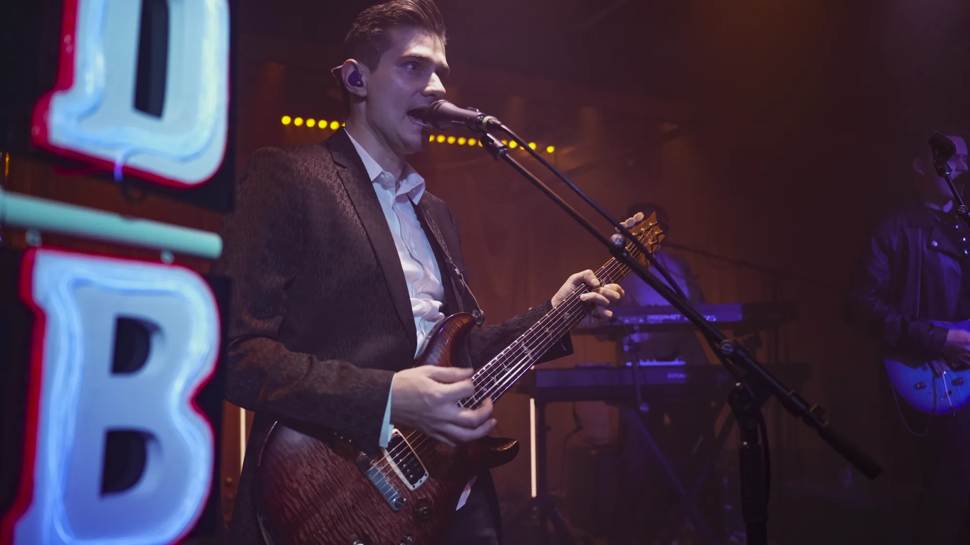 Don’t Believe in Ghosts bassist performing on stage